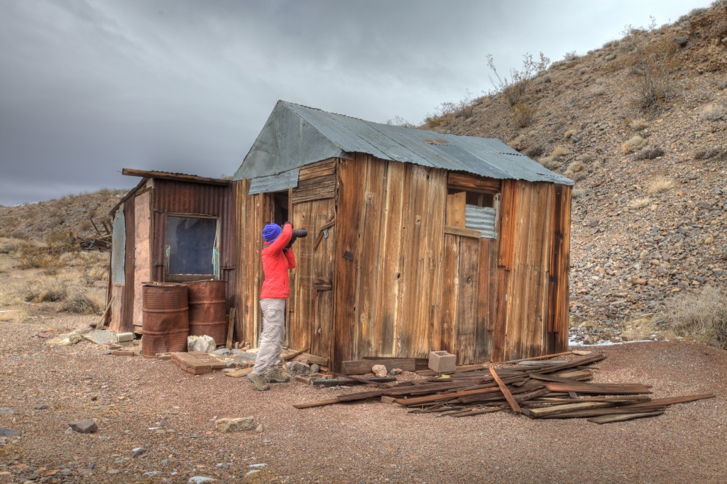 Penelope Photographing the Cabin at Tucki Mine in Death Valley